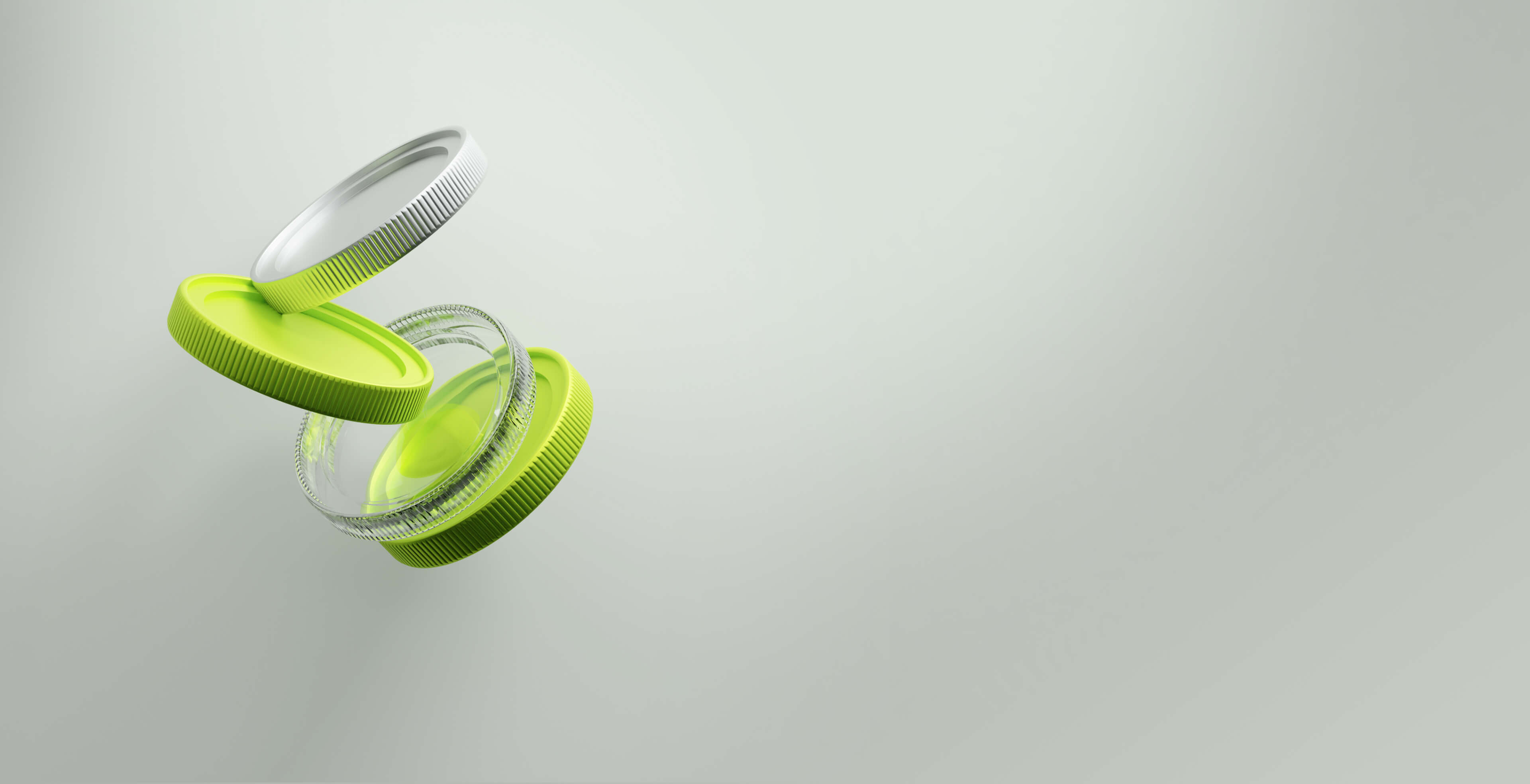 Stack of floating bottle caps in green, white, and transparent colors